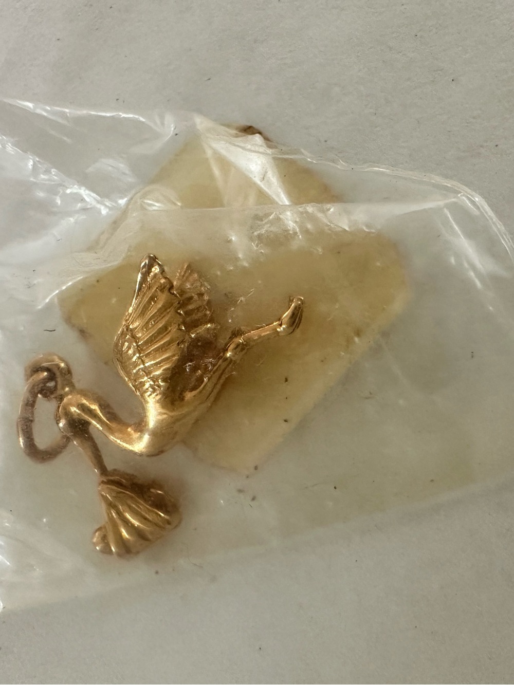 Vintage 14 karat new baby charm in original package